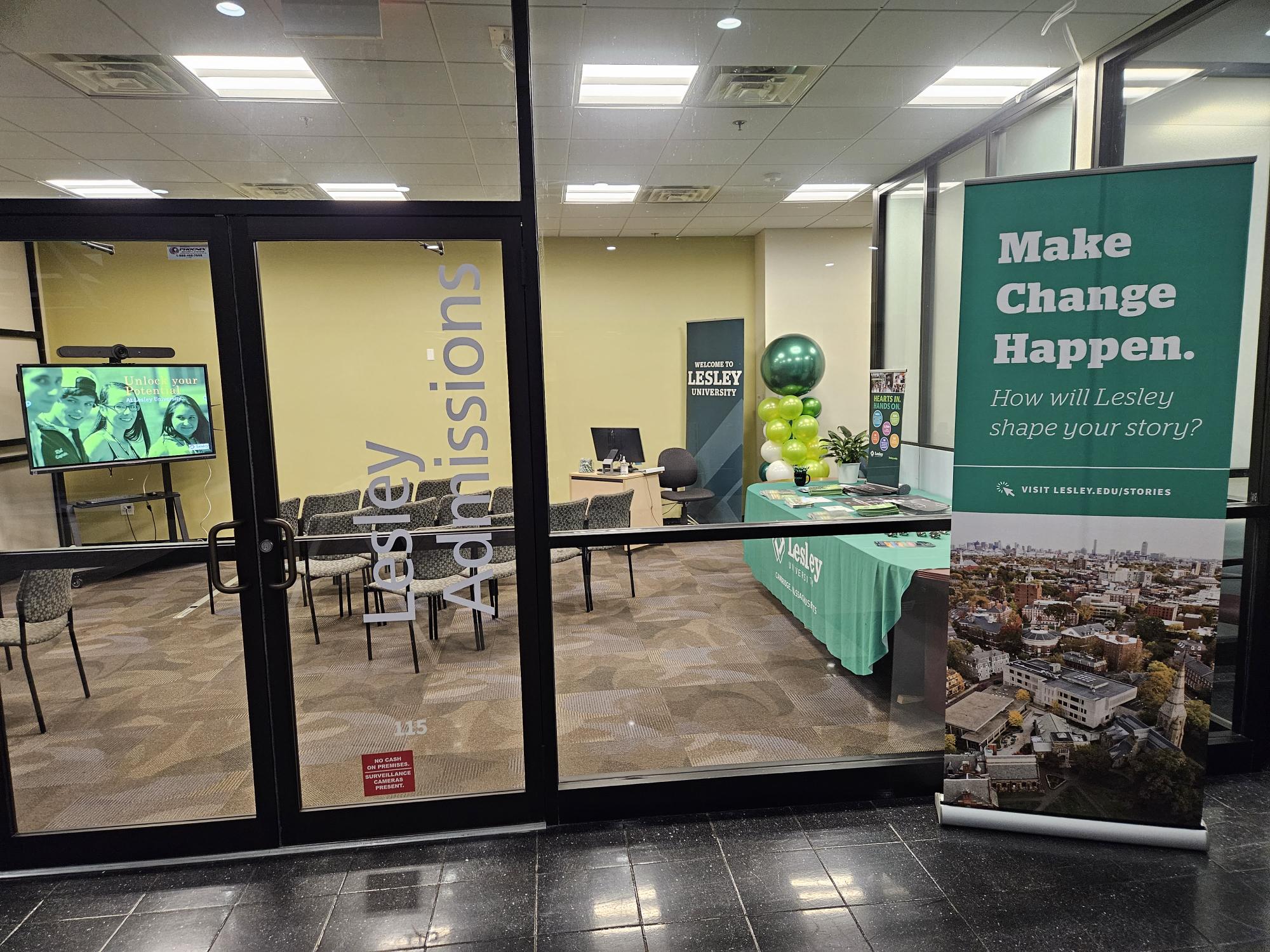 Photo of the admissions office with green sign that says make change happen
