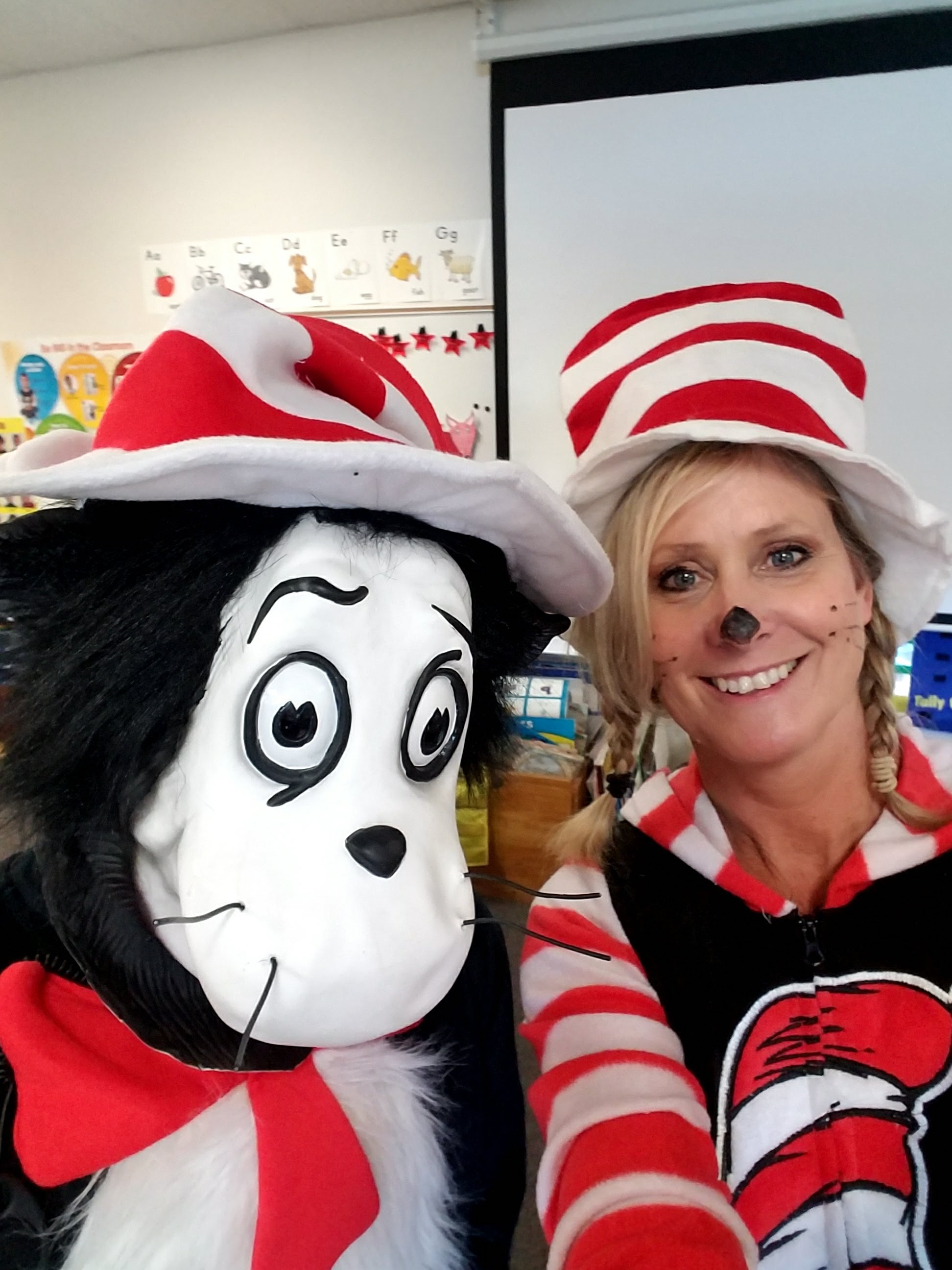 Colleen Smith dressed as the Cat in the Hat with someone in a Cat in the Hat suit