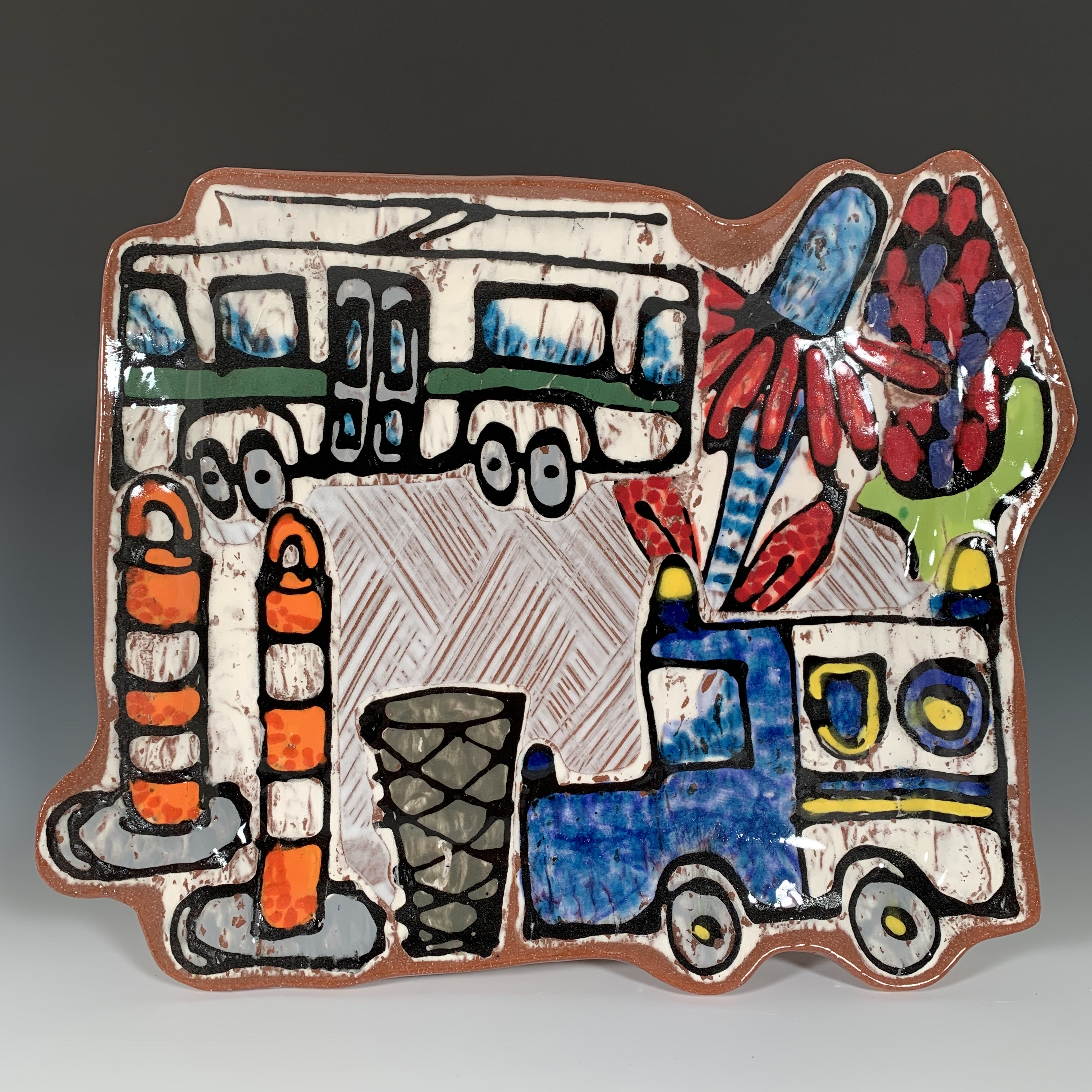 Platter with a truck, bus, flowers, and traffic cones