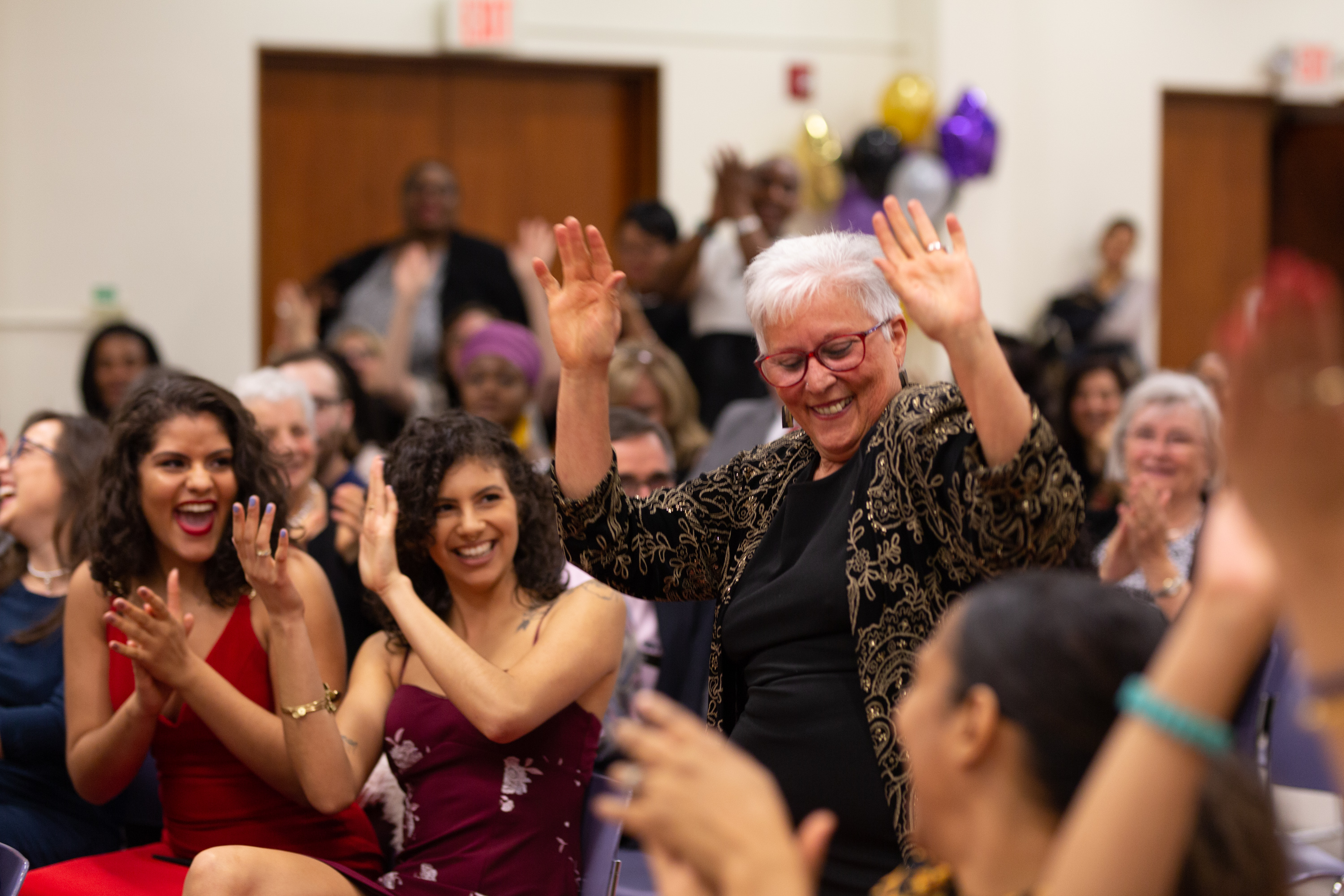 Students cheer on Dalia Llera as she dances through the crowd