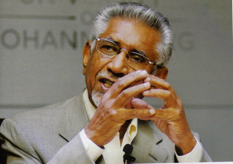 mac maharaj, hands together, in deep thought