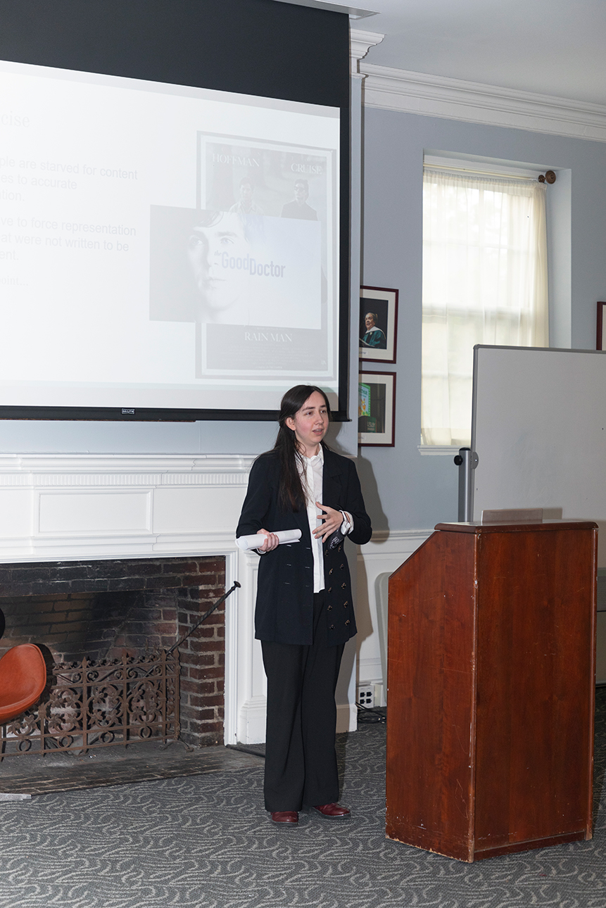 A photo of Maeve Rotolo n presenting her Honors research project in Alumni Hall at the 2022 Honors Symposium