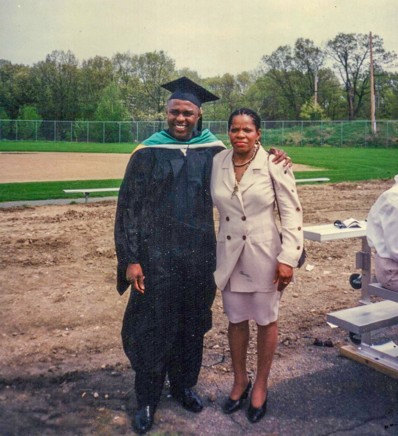 Martin Pierre in cap and gown with mother