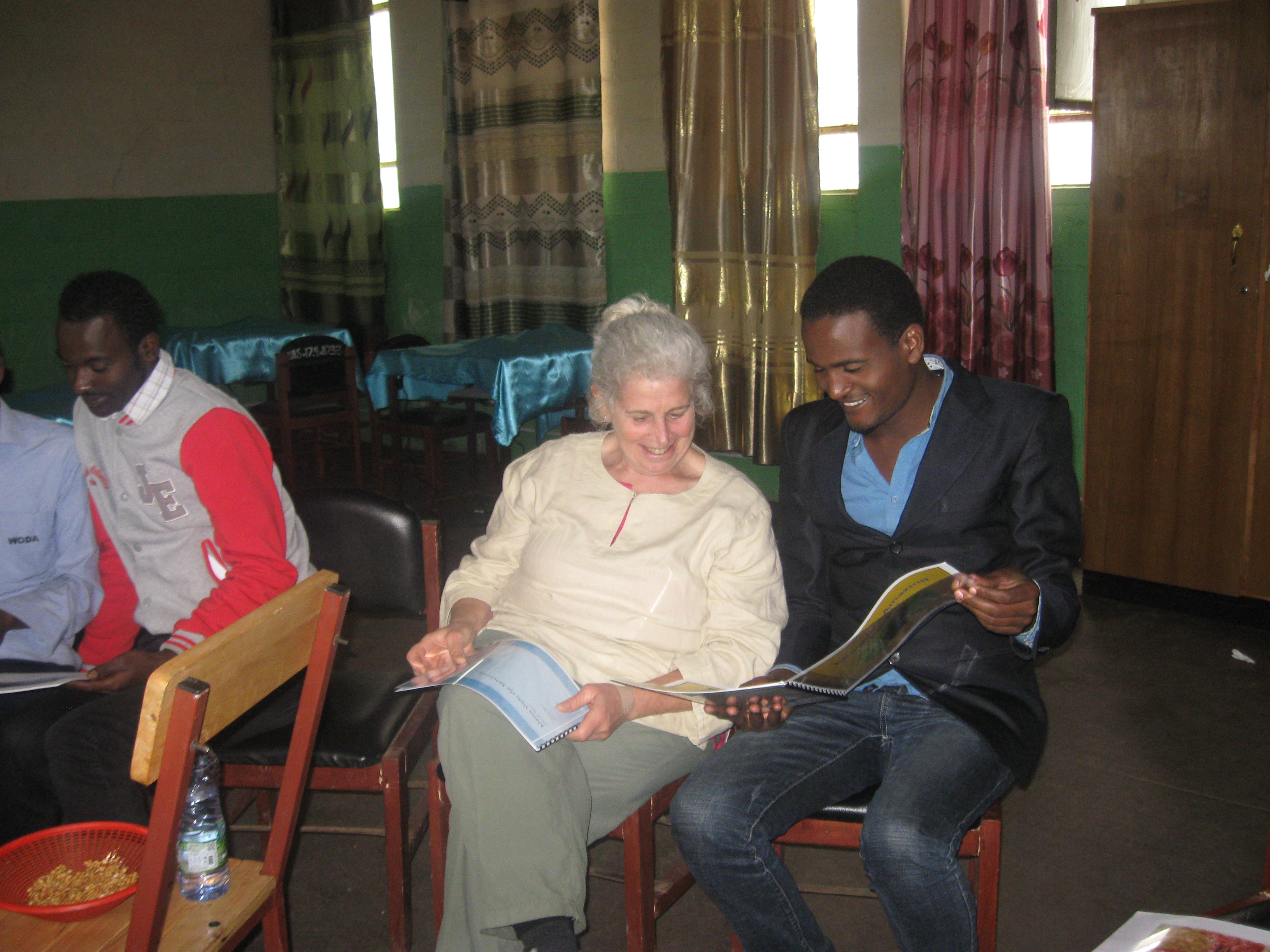 Professor Susan Rauchwerk in Ethiopia showing her children's book to locals.