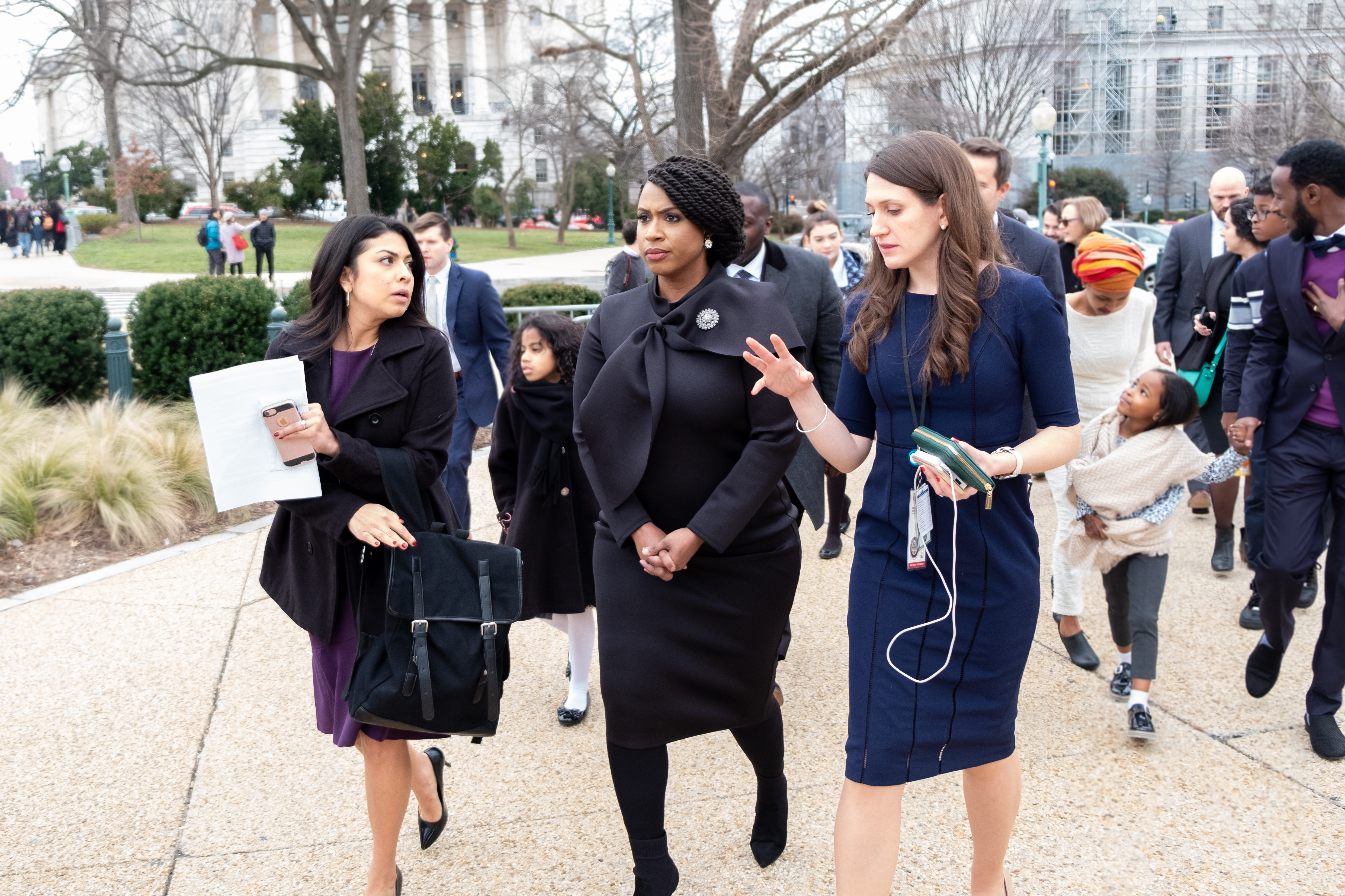 Sarah Groh walks beside Congresswoman Ayanna Pressley