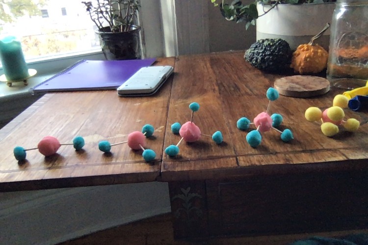 A table with a science model made of playdough