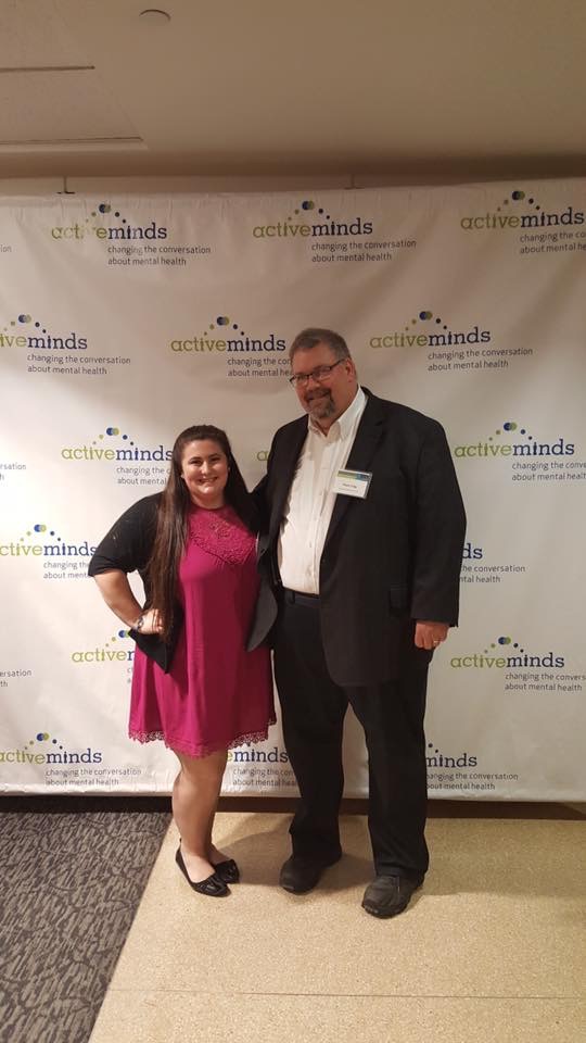 Rachel DiGangi in front of Active Minds sign with Thom Craig at national conference in Washington, D.C.
