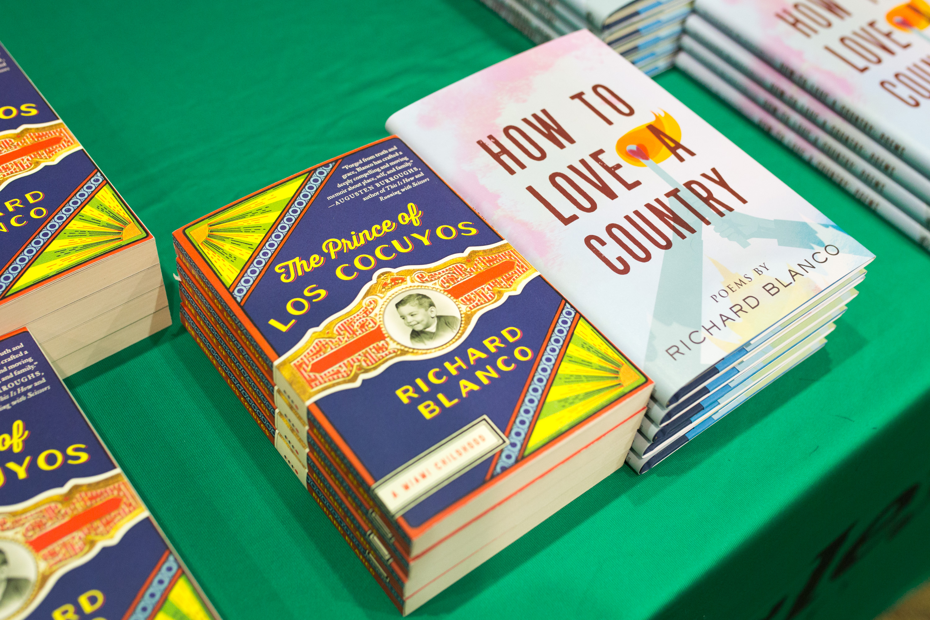 Two stacks of books by Richard Blanco: The Prince of Los Cocuyos and How to Love a Country.