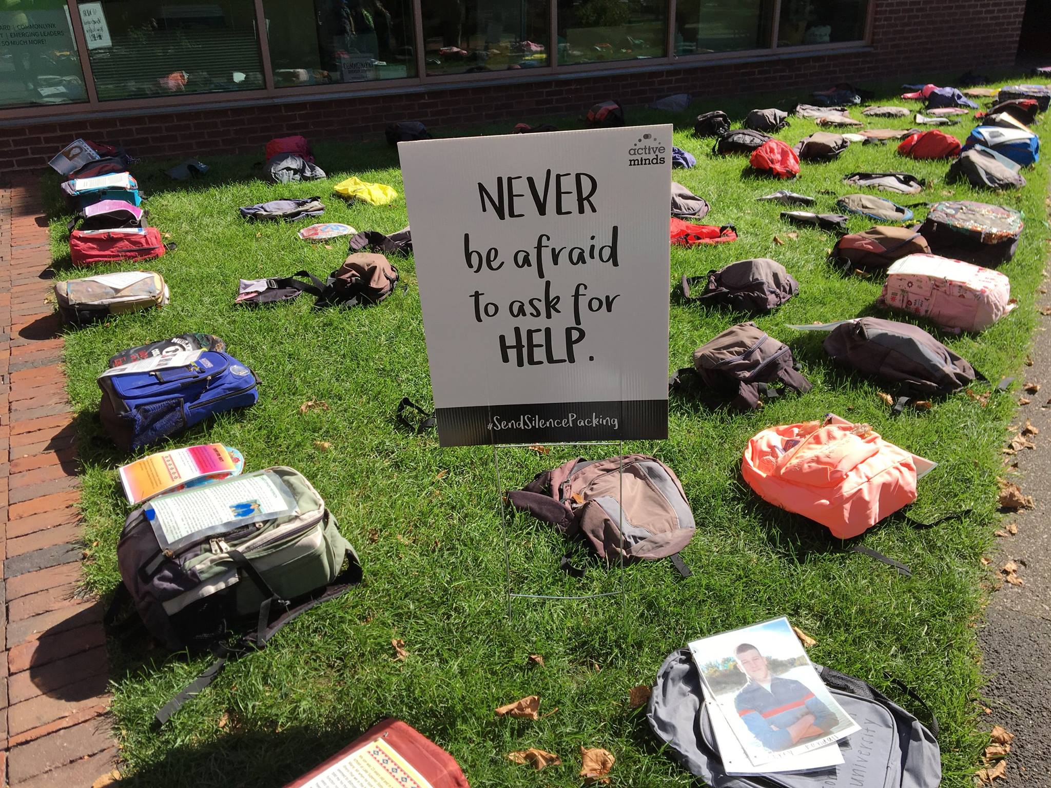 Backpacks on the grass of Doble Quad for Send Silence Packing event.