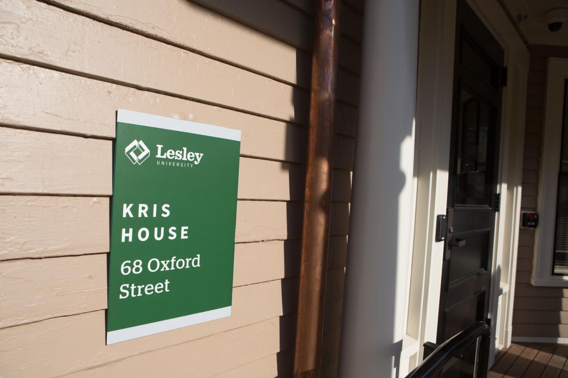Up close shot of the "kris house" sign 