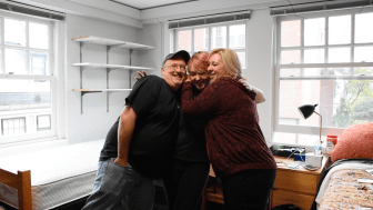 Family hugs on move-in day.