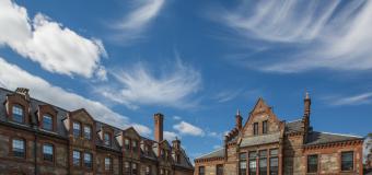 Wispy clouds and a blue sky over Lawrence Hall.
