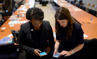 Sarah Groh and U.S. Representative Ayanna Pressley working together by Meredith Nierman, WGBH News