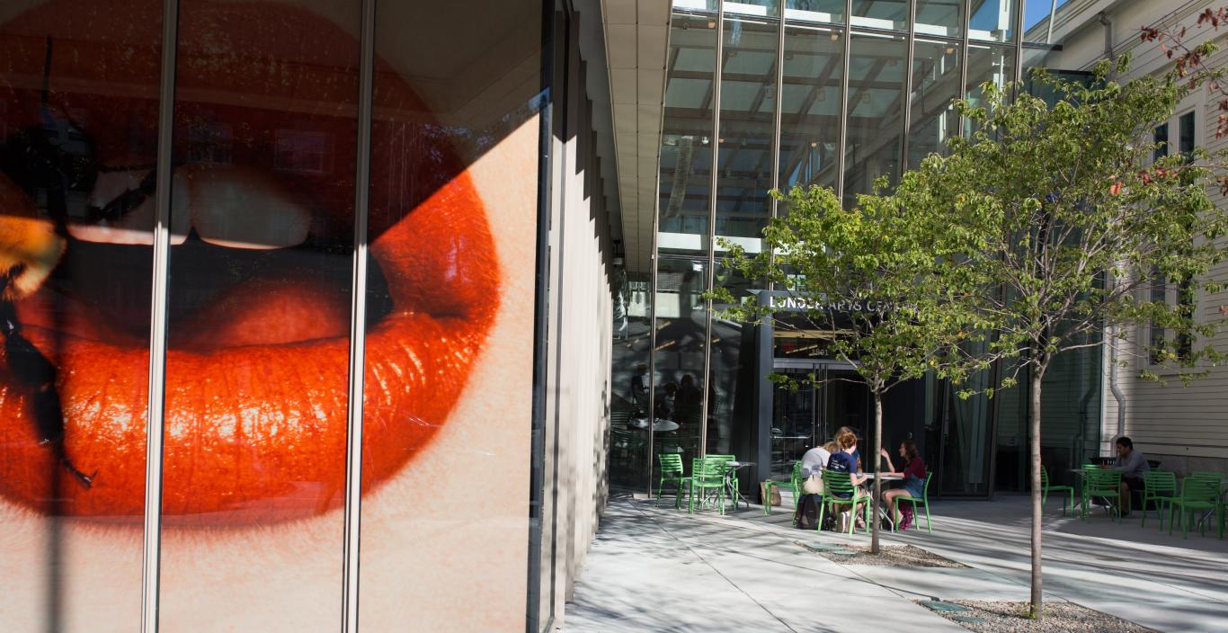 A larger than life Irving Penn photo of red lips taken from outside Lunder Art Center
