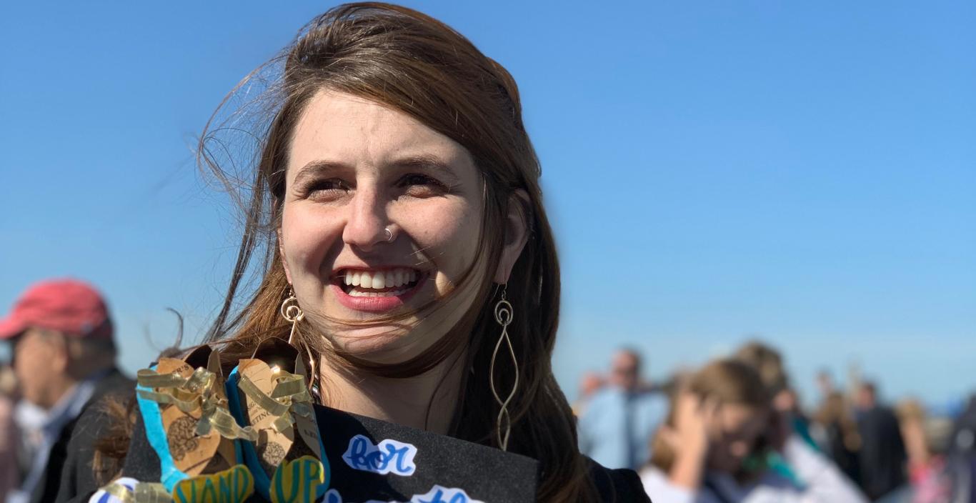 Katya Zinn is pictured smiling amid the crowd at Lesley Commencement