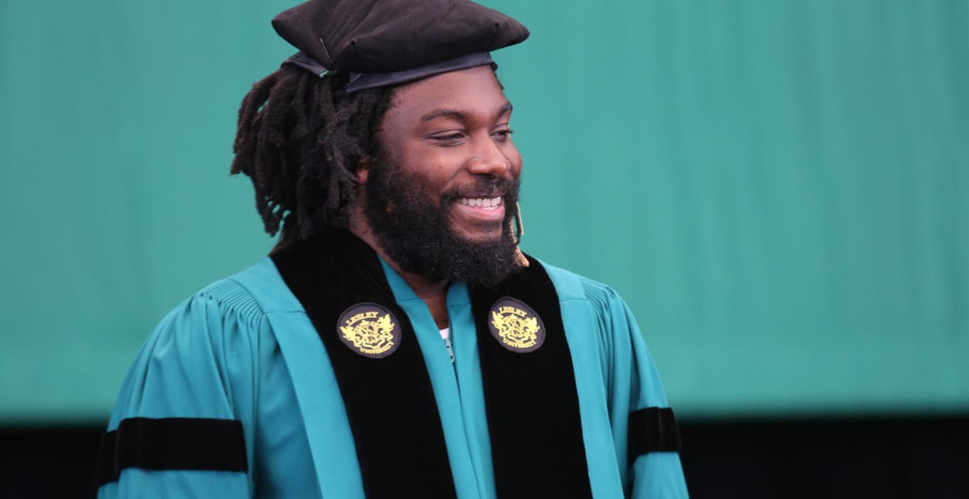 Jason Reynolds in regalia at Commencement 2018