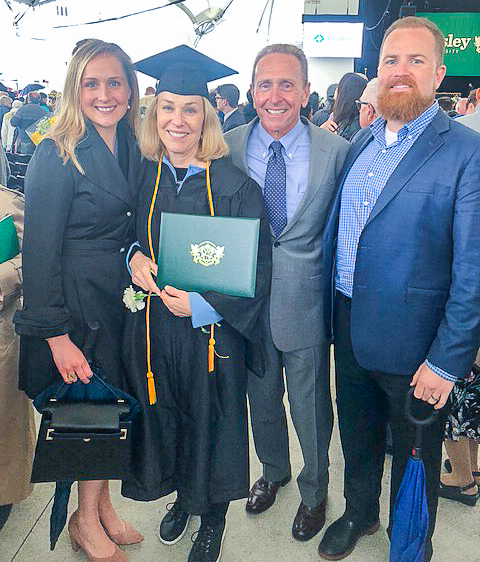 Anusia Hirsh at graduation with her adult daughter and son and husband.