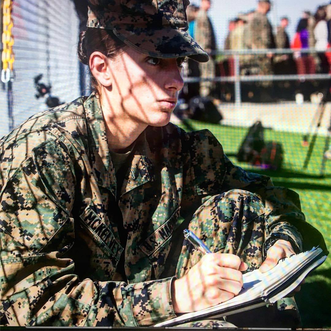 Sgt. Elize McKeley sketching in her camo uniform