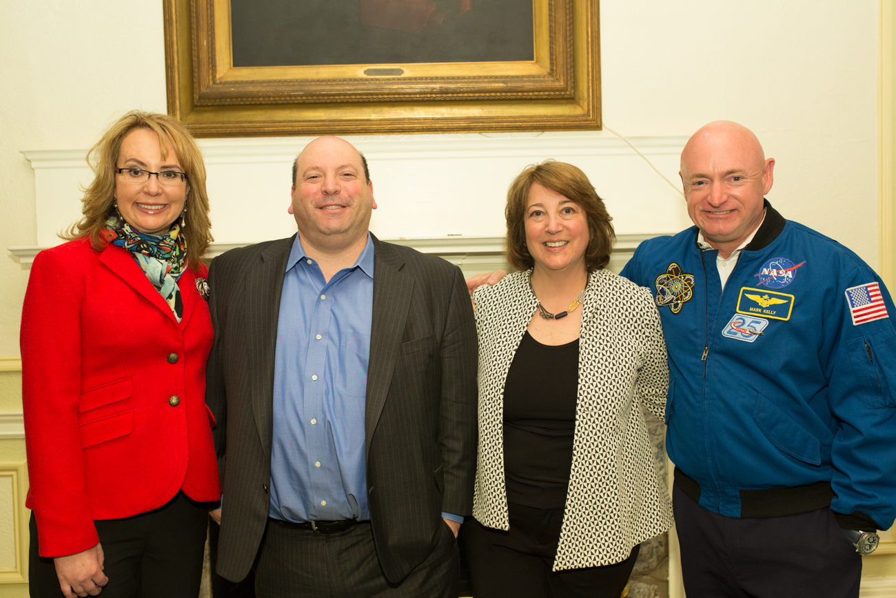  Gabby Giffords and Mark Kelley pose with President Jeff Weiss and his wife Gerri.