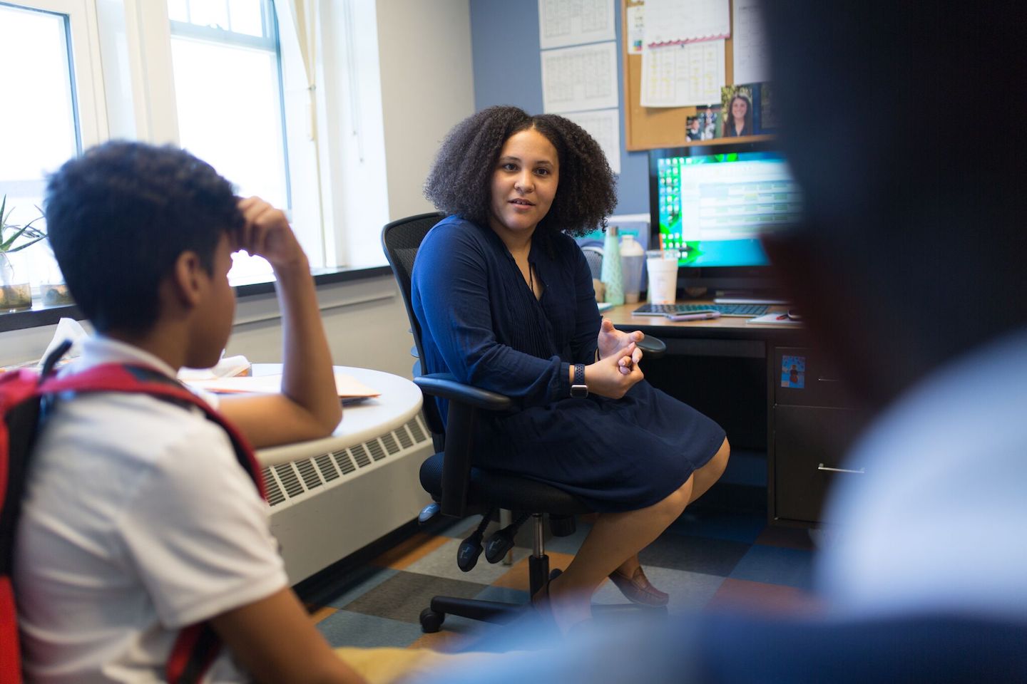 Leona Watson Counseling two Students in her office