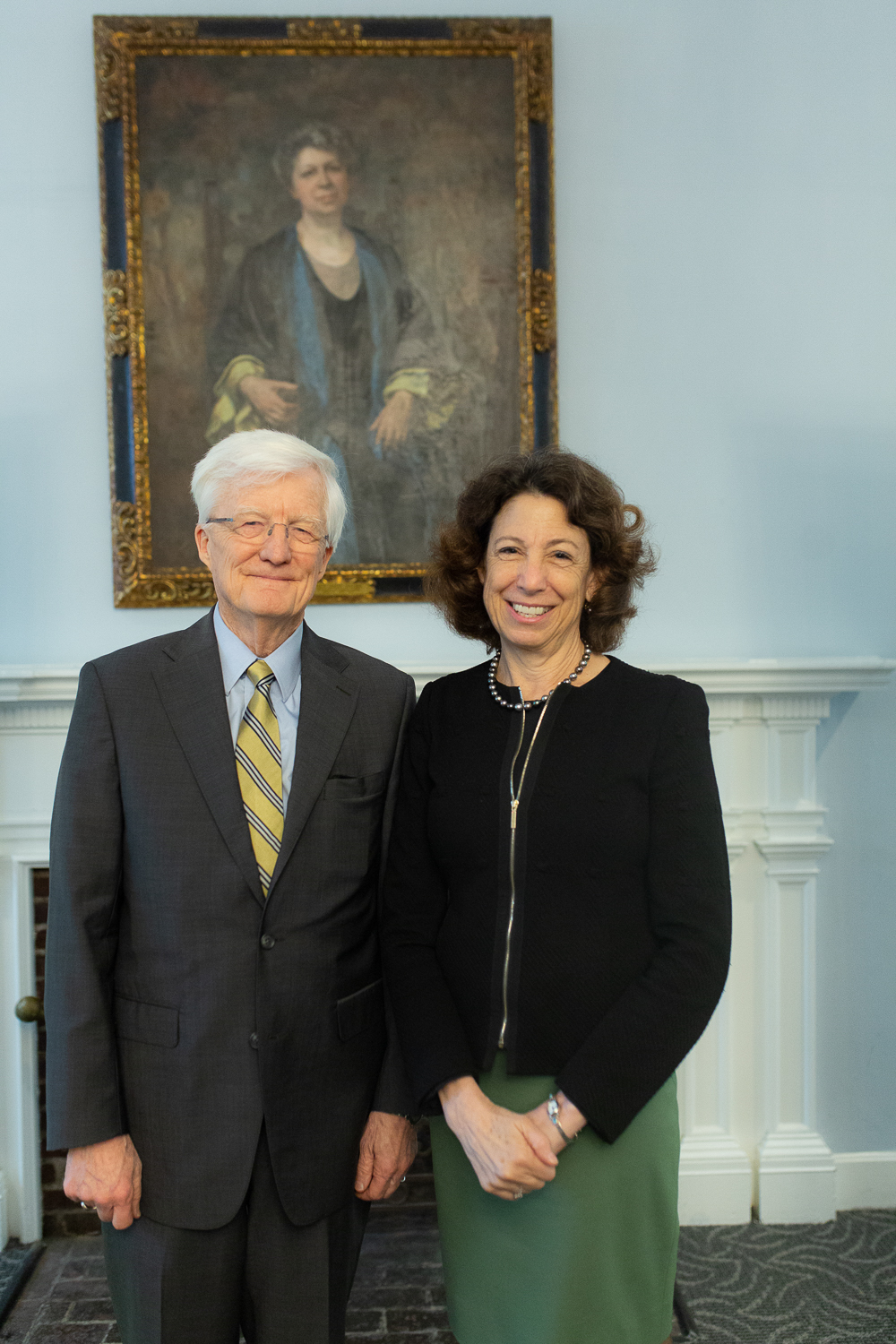 Left to right: Interim President Rich Hansen and President-elect Janet Steinmayer in front of a painting of Edith Lesley.