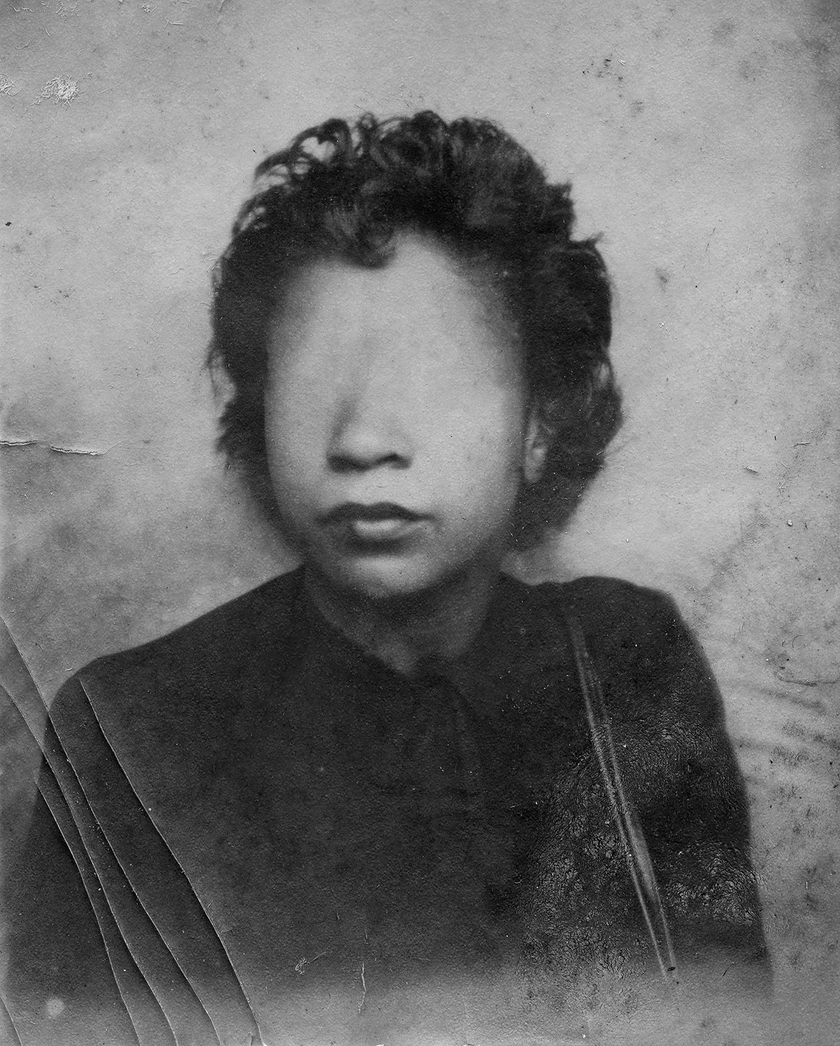 Black and white portrait with face obscured