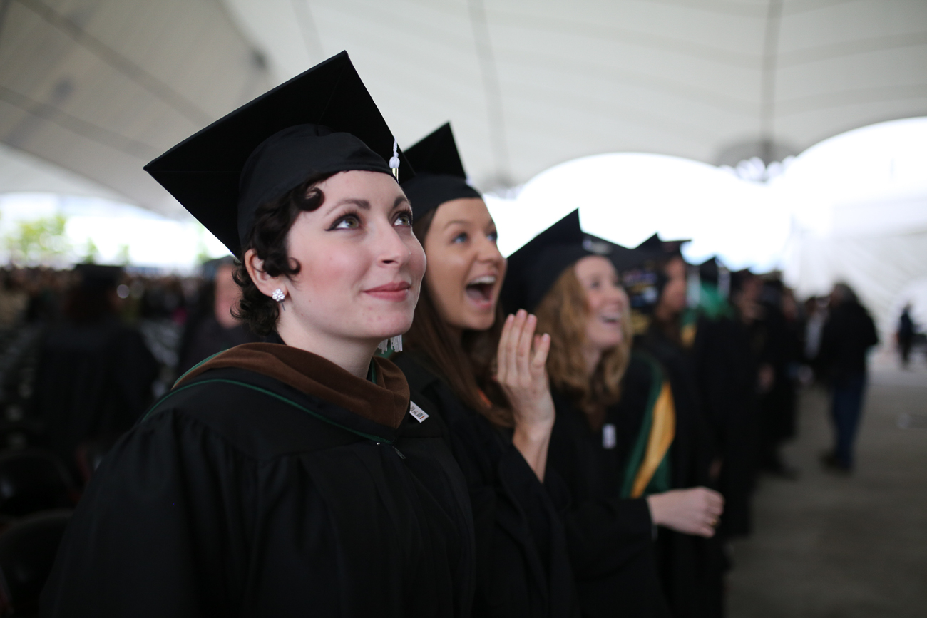 Students at Commencement looking up and hopeful.