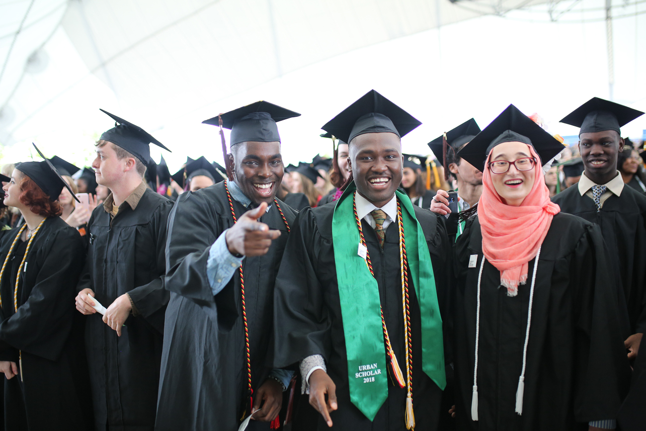 Rocky Cotard, Sara Alfageeh, smiling, excited in crowd at graduation