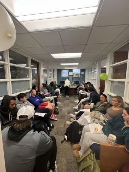 students in business club sitting in a room