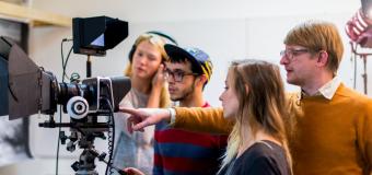 digital filmmaking instructor guiding students 