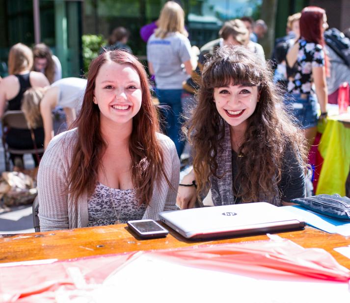 two students at the club and organizations fair