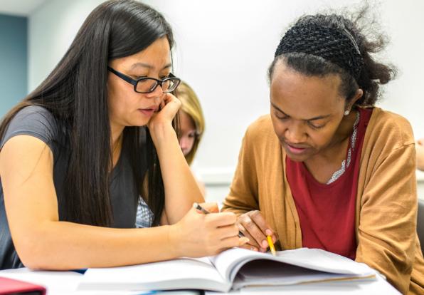 2 female students studying in classroom at Bunker Hill Community College